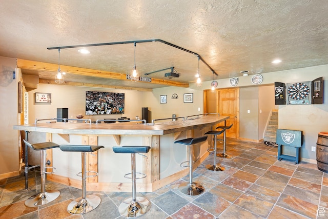665 E 3550 N, North Ogden, UT 84414 - indoor wet bar featuring a textured ceiling, stone finish floors, stairs, recessed lighting, and decorative light fixtures