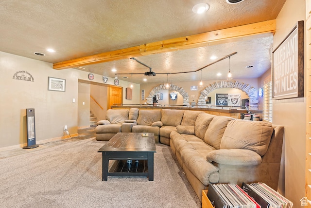 665 E 3550 N, North Ogden, UT 84414 - living room featuring a textured ceiling, carpet floors, stairs, recessed lighting, and beamed ceiling
