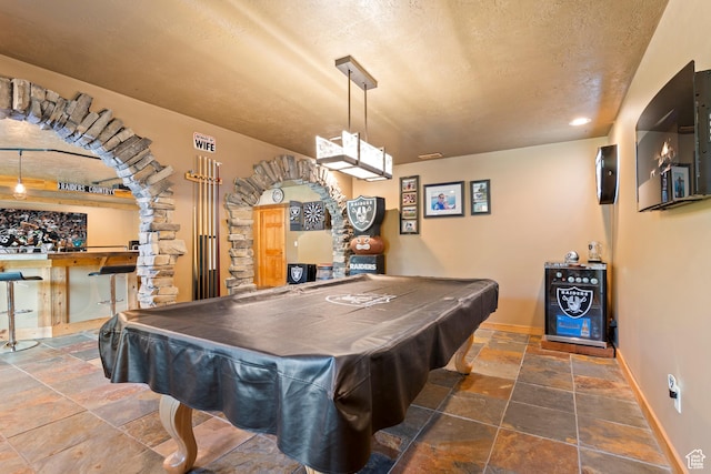 665 E 3550 N, North Ogden, UT 84414 - game room featuring stone tile floors, pool table, a textured ceiling, and bar