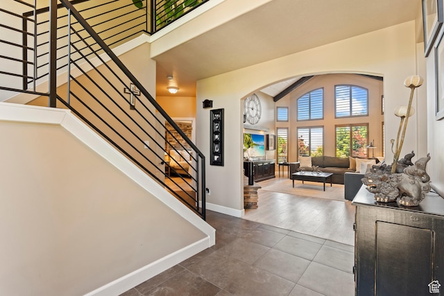 665 E 3550 N, North Ogden, UT 84414 - entryway with arched walkways, stairs, and tile patterned flooring