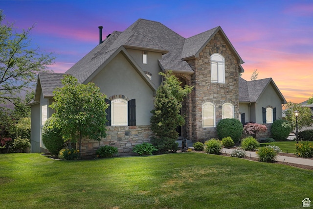 665 E 3550 N, North Ogden, UT 84414 - french country home featuring stone siding, stucco siding, a front yard, and a shingled roof
