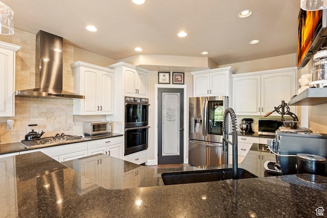 665 E 3550 N, North Ogden, UT 84414 - kitchen featuring wall chimney exhaust hood, appliances with stainless steel finishes, white cabinets, tasteful backsplash, and recessed lighting