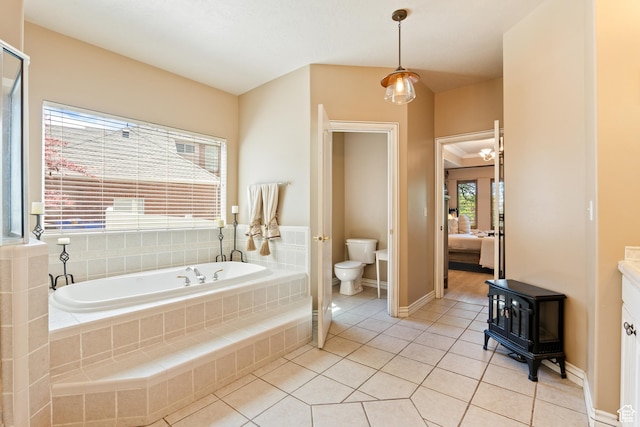 665 E 3550 N, North Ogden, UT 84414 - ensuite bathroom featuring a bath, tile patterned flooring, a wood stove, and vanity