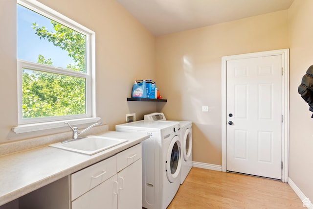 665 E 3550 N, North Ogden, UT 84414 - washroom with cabinet space, independent washer and dryer, plenty of natural light, and light wood-style floors