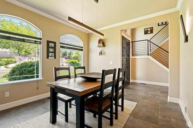 665 E 3550 N, North Ogden, UT 84414 - dining space with crown molding, stairway, and dark stone finish flooring
