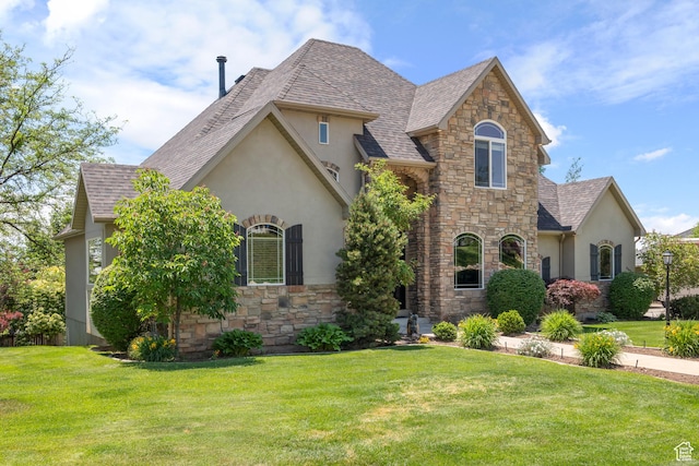 665 E 3550 N, North Ogden, UT 84414 - french country style house featuring stucco siding, stone siding, and a front lawn