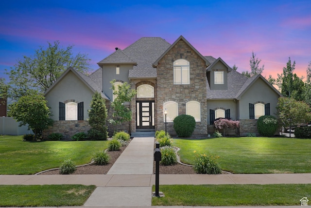 665 E 3550 N, North Ogden, UT 84414 - french provincial home featuring stucco siding, stone siding, a front lawn, and roof with shingles