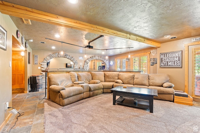 665 E 3550 N, North Ogden, UT 84414 - living room featuring stone tile floors, recessed lighting, and a textured ceiling