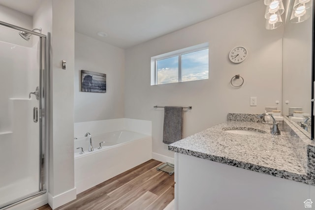 940 N Center St, Santaquin, UT 84655 - full bathroom featuring a stall shower, wood finished floors, vanity, and a bath