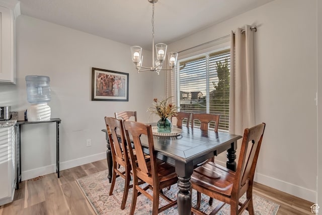 940 N Center St, Santaquin, UT 84655 - dining area with a chandelier and light wood-type flooring
