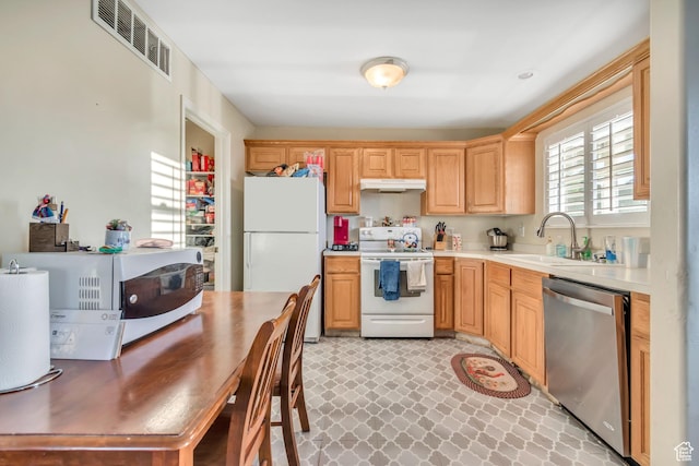 382 N Peach St, Santaquin, UT 84655 - kitchen with white appliances, light countertops, under cabinet range hood, and light brown cabinetry