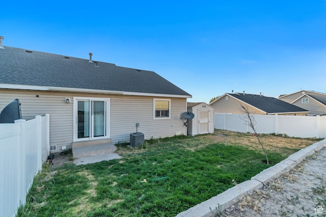 382 N Peach St, Santaquin, UT 84655 - back of house featuring a storage shed, a fenced backyard, and a shingled roof