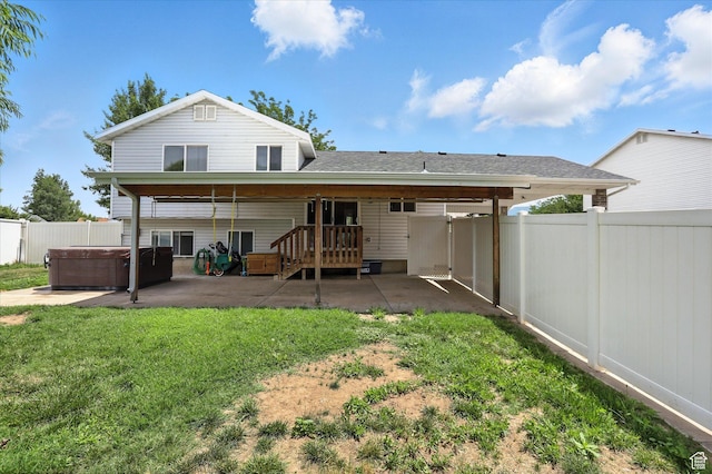 416 N 450 W, Clearfield, UT 84015 - back of property with a hot tub, a patio, and a fenced backyard