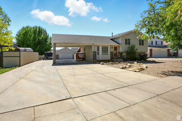 416 N 450 W, Clearfield, UT 84015 - tri-level home featuring concrete driveway, an attached garage, and roof with shingles