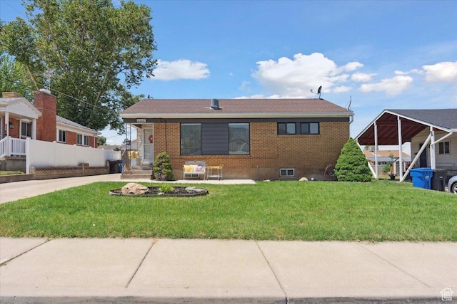 4447 S 100 W, Washington Terrace, UT 84405 - view of front of house featuring brick siding and a front yard