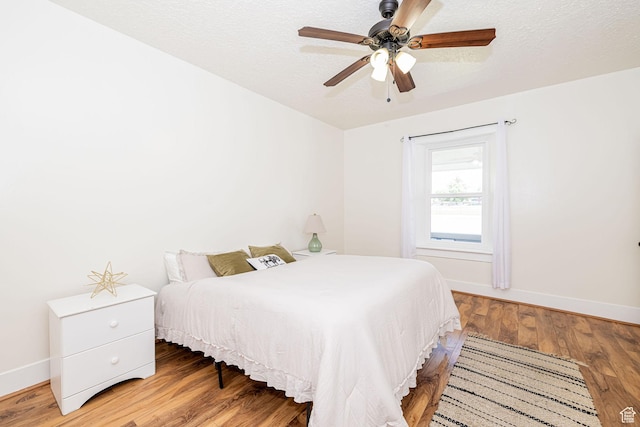 13 N 100 W, Smithfield, UT 84335 - bedroom featuring wood finished floors, a ceiling fan, and a textured ceiling