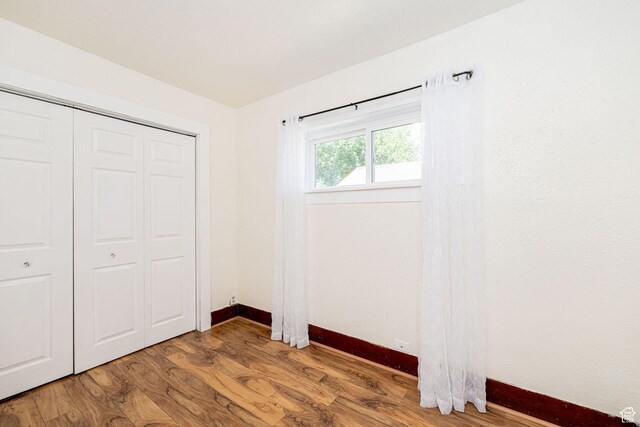 13 N 100 W, Smithfield, UT 84335 - unfurnished bedroom with wood finished floors and a closet