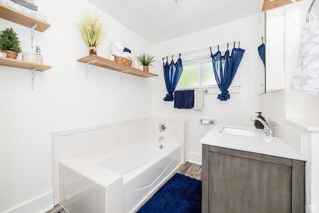 13 N 100 W, Smithfield, UT 84335 - bathroom with a garden tub, vanity, and wood finished floors