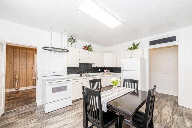 13 N 100 W, Smithfield, UT 84335 - kitchen with white appliances, light countertops, tasteful backsplash, and white cabinets