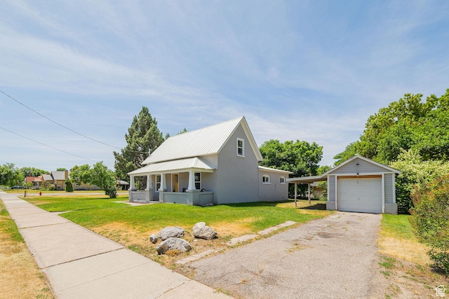 13 N 100 W, Smithfield, UT 84335 - view of front of property featuring a front lawn, a detached garage, asphalt driveway, and an outdoor structure