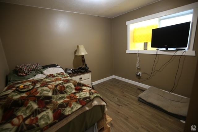 591 E Acoma Rd A-B, Unit A-B Midvale, UT 84047 - bedroom with wood finished floors and baseboards