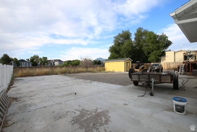 591 E Acoma Rd A-B, Unit A-B Midvale, UT 84047 - view of patio featuring a storage unit
