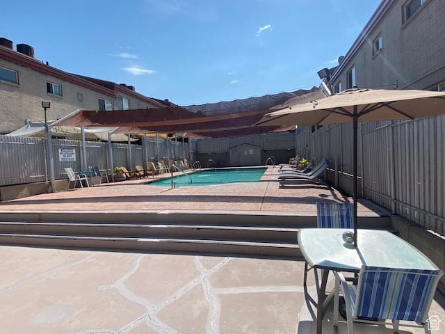 650 N 300 W Unit 206, Salt Lake City, UT 84103 - community pool featuring a fenced backyard and a patio