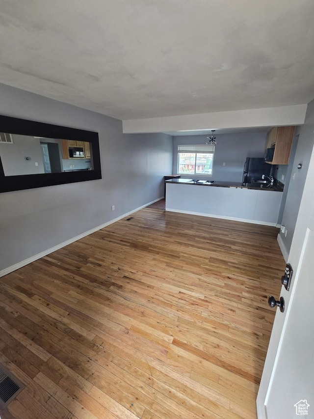 650 N 300 W Unit 206, Salt Lake City, UT 84103 - unfurnished room featuring hardwood / wood-style floors and baseboards