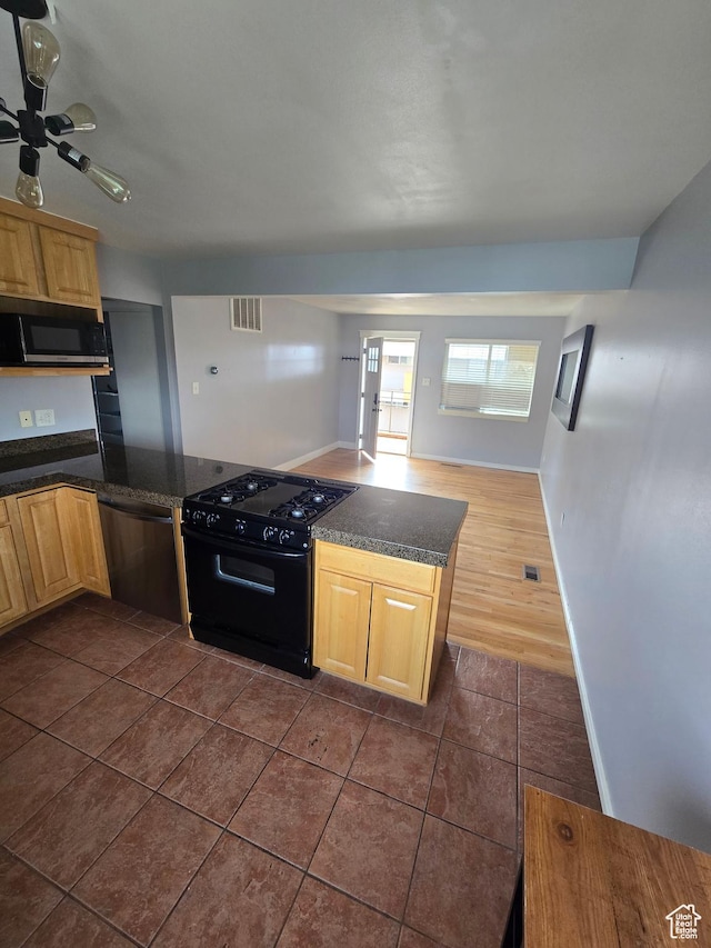 650 N 300 W Unit 206, Salt Lake City, UT 84103 - kitchen with black range with gas cooktop, dishwasher, light brown cabinets, and dark tile patterned flooring