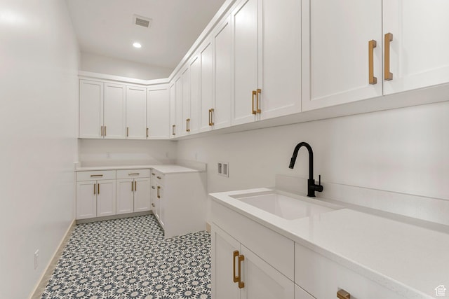 1762 S 920 W, Hurricane, UT 84737 - washroom featuring cabinet space, washer hookup, tile patterned floors, and recessed lighting