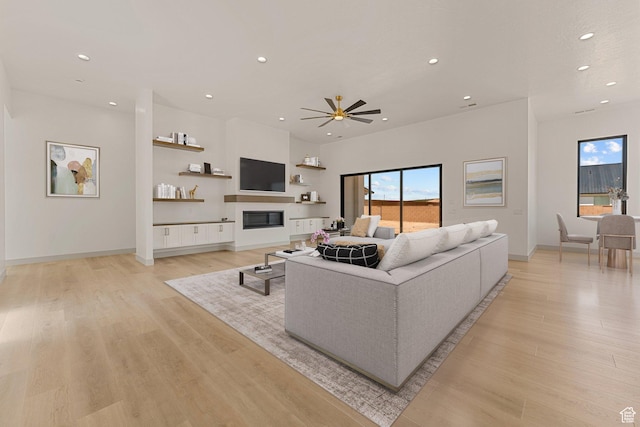 1762 S 920 W, Hurricane, UT 84737 - living area featuring recessed lighting, light wood-type flooring, ceiling fan, and a glass covered fireplace