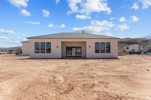 1762 S 920 W, Hurricane, UT 84737 - rear view of house with a tile roof, stucco siding, and a mountain view