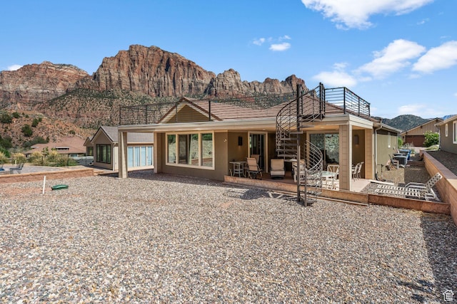 130 Matilda Ln, Springdale, UT 84767 - rear view of property with a mountain view, a patio area, and a balcony