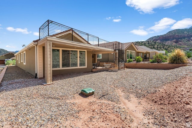 130 Matilda Ln, Springdale, UT 84767 - rear view of property featuring stairs, a mountain view, and a patio