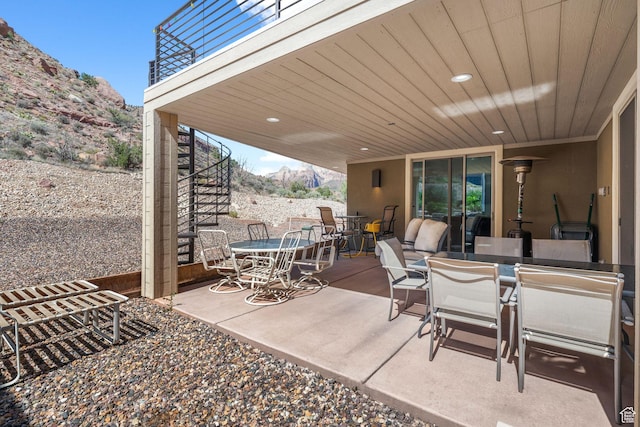 130 Matilda Ln, Springdale, UT 84767 - view of patio with a mountain view, outdoor dining space, and stairs