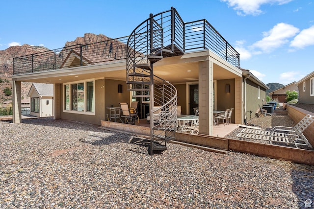 130 Matilda Ln, Springdale, UT 84767 - rear view of house featuring stairway, a patio, and stucco siding