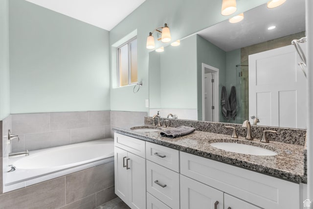 130 Matilda Ln, Springdale, UT 84767 - bathroom featuring a bath, double vanity, and a shower stall