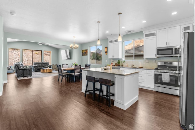 130 Matilda Ln, Springdale, UT 84767 - kitchen with stainless steel appliances, white cabinets, a center island, dark wood-style flooring, and recessed lighting