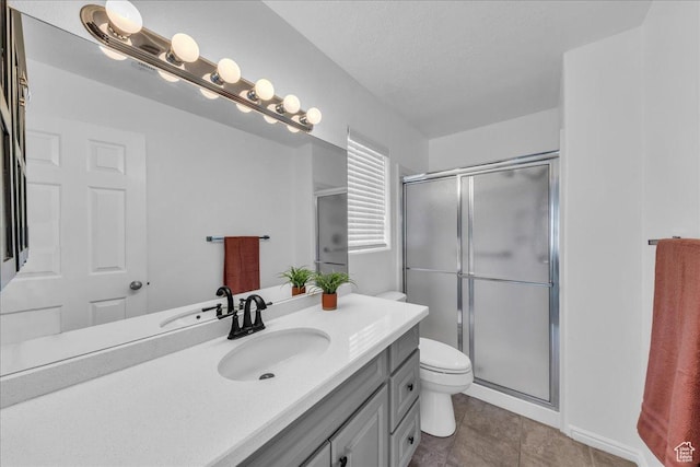 1090 E 700 S Unit 24, St George, UT 84790 - bathroom featuring vanity, a stall shower, a textured ceiling, and tile patterned floors