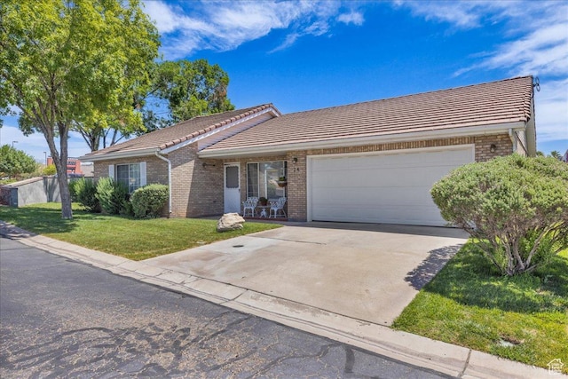1090 E 700 S Unit 24, St George, UT 84790 - ranch-style home with a tile roof, brick siding, and a garage