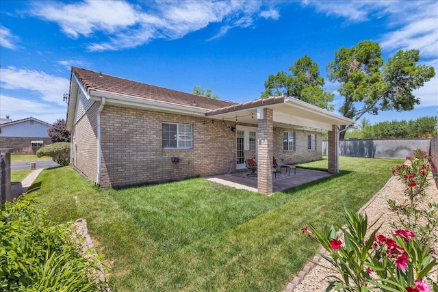 1090 E 700 S Unit 24, St George, UT 84790 - back of property with brick siding, a patio, and french doors