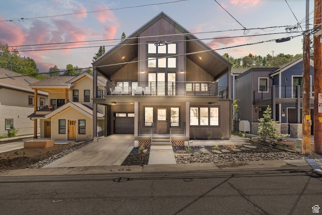 51 Daly Ave, Park City, UT 84060 - view of front of house featuring a balcony, a garage, and concrete driveway