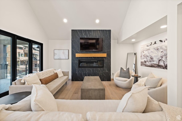 51 Daly Ave, Park City, UT 84060 - living room featuring recessed lighting, high vaulted ceiling, a fireplace, and wood finished floors