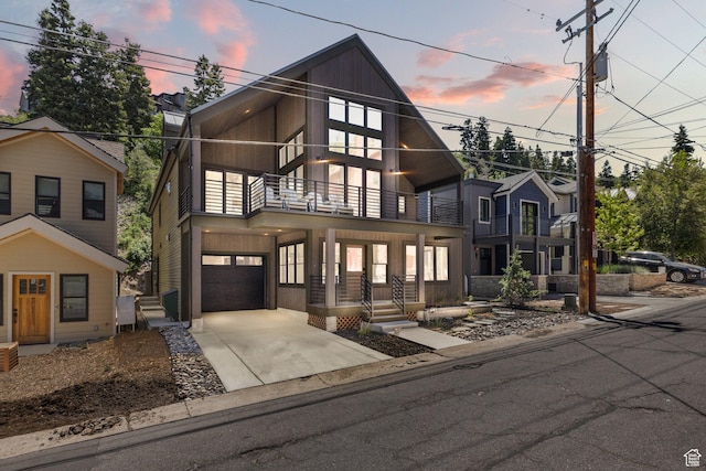 51 Daly Ave, Park City, UT 84060 - contemporary house featuring a balcony, an attached garage, and concrete driveway