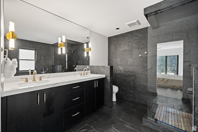 51 Daly Ave, Park City, UT 84060 - full bath featuring tile walls, marble tiled flooring, connected bathroom, and double vanity