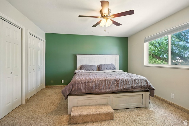 1260 S Riverview Dr, Garland, UT 84312 - bedroom with two closets, light carpet, and ceiling fan
