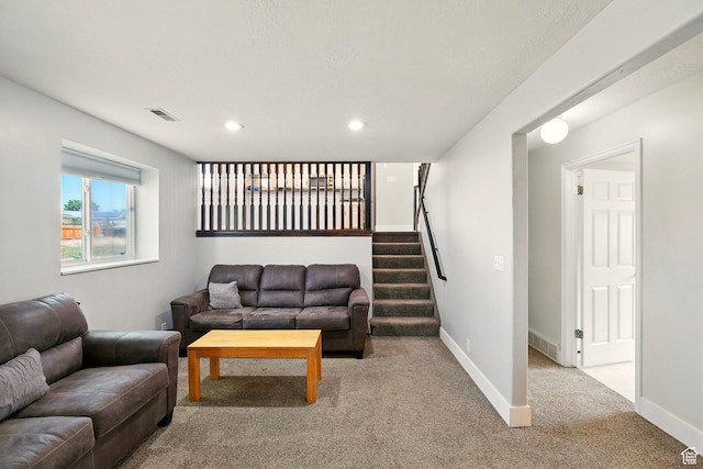 1260 S Riverview Dr, Garland, UT 84312 - living room featuring carpet flooring, recessed lighting, and stairway