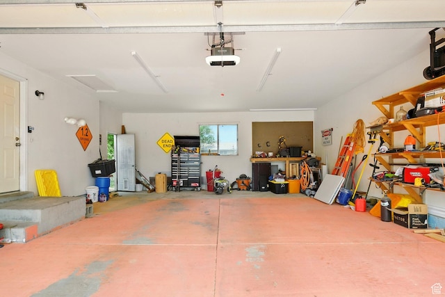 1260 S Riverview Dr, Garland, UT 84312 - garage featuring a garage door opener