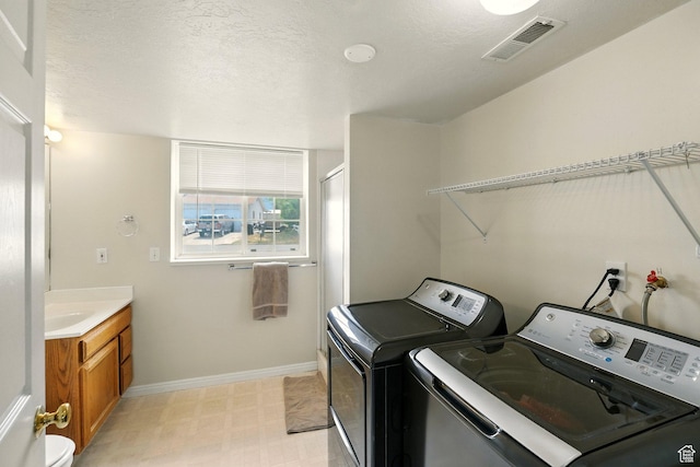 1260 S Riverview Dr, Garland, UT 84312 - laundry room featuring independent washer and dryer and light flooring