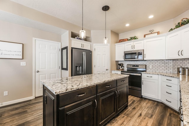 6743 W Spring Oak Dr, West Jordan, UT 84081 - kitchen featuring appliances with stainless steel finishes, white cabinetry, dark wood finished floors, and recessed lighting